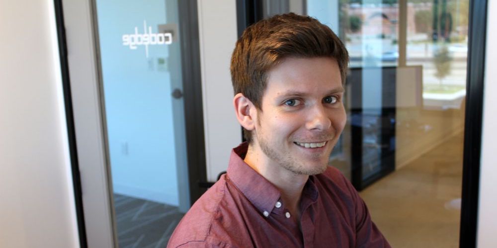 Henry Popp of Codedge sitting at his desk